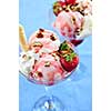 Strawberry ice cream sundae with fresh strawberries and walnuts