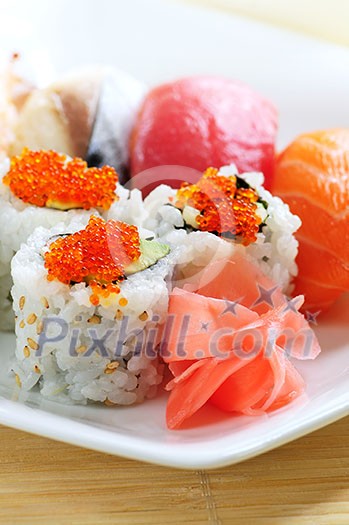 Sushi and california rolls on a plate close up Sushi and california rolls on a plate close up