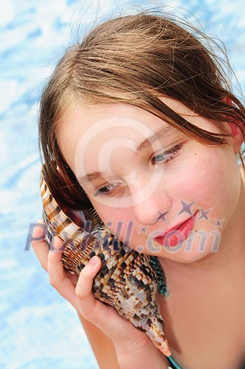 Portrait of a teenage girl with large tropical seashell Portrait of a teenage girl with large tropical seashell