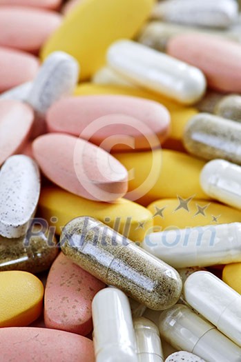 Mix of vitamins and herbal supplements close up