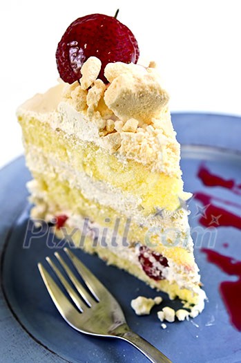 Slice of strawberry meringue cake on a plate