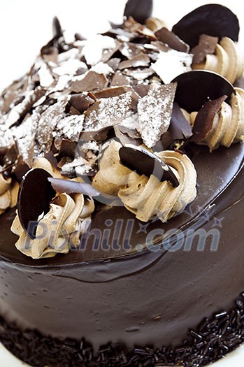 Round chocolate cake with frosting close up