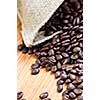 Roasted coffee beans in a rustic canvas bag