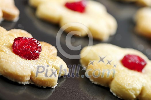 Fresh shortbread cookies on a baking tray