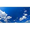 Panoramic background of blue sky with white cumulus clouds