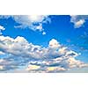 Background of blue sky with white cumulus clouds