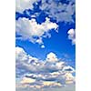 Background of blue sky with white cumulus clouds