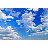 Background of blue sky with white cumulus clouds