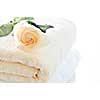 Stack of soft luxury towels with fresh flower
