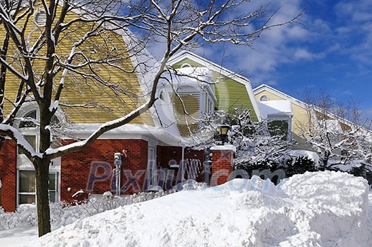 Winter street with lots of snow and colorful houses in Toronto