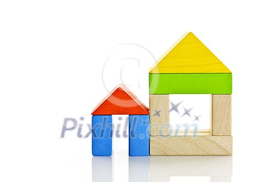 Houses built out of toy wooden building blocks Houses built out of toy wooden building blocks