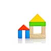 Houses built out of toy wooden building blocks