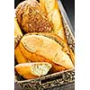 Various kinds of fresh baked bread in basket