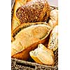 Various kinds of fresh baked bread in basket