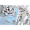 Wrapped gift box with silver Christmas ornaments