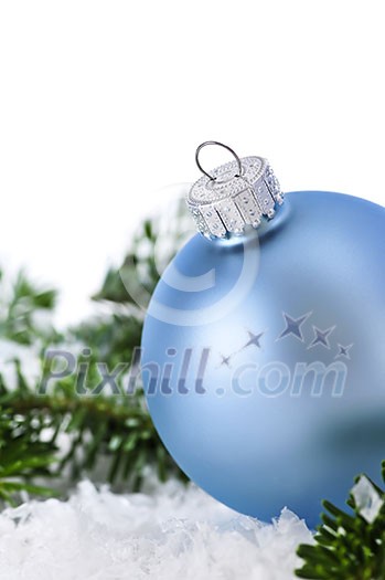 Blue Christmas decoration in snow with pine branches