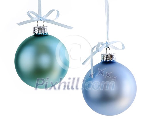 Two Christmas decorations hanging isolated on white Two Christmas decorations hanging isolated on white