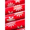 Closeup of many red Christmas crackers in a row