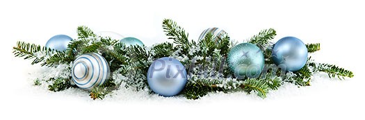 Many Christmas decorations laying in pine branches and snow Many Christmas decorations laying in pine branches and snow