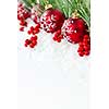 Red Christmas decorations with pine branches with copy space