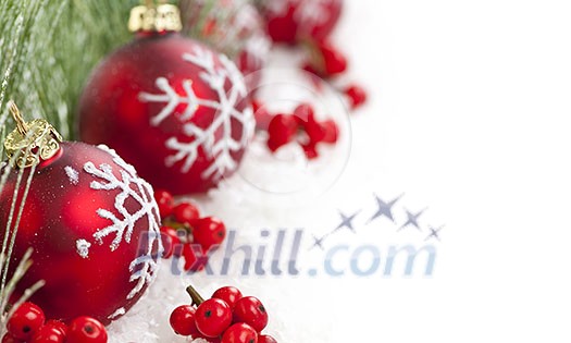 Red Christmas decorations with pine branches with copy space