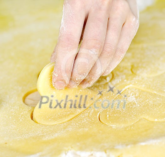 Making heart shaped shortbread cookies by hand