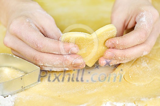 Making heart shaped shortbread cookies with cutters