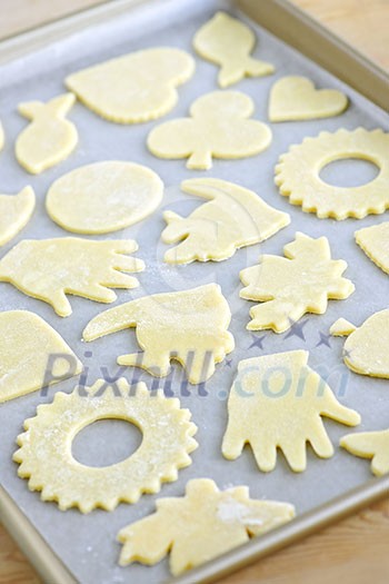 Cookie tray with raw homemade cookies ready for baking Cookie tray with raw homemade cookies ready for baking