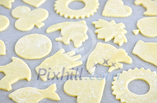 Cookie tray with raw homemade cookies ready for baking Cookie tray with raw homemade cookies ready for baking