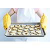 Woman holding fresh baked homemade shortbread cookies on cookie tray