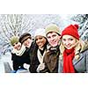 Group of diverse young friends outdoors in winter