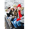 Group of diverse young friends outdoors in winter