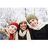 Group of three diverse young girl friends outdoors in winter