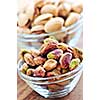 Close up of pistachio nuts in glass bowls