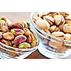 Close up of pistachio nuts in glass bowls