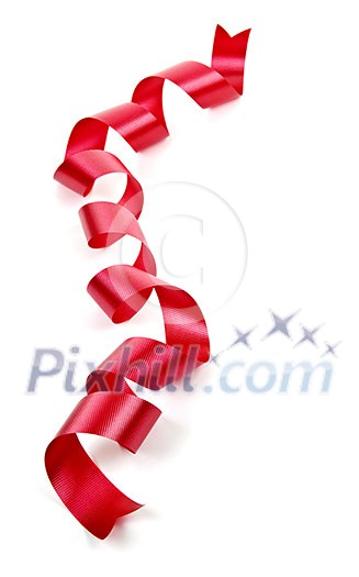 Curled red holiday ribbon strip isolated on white background