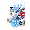 Rolls of Christmas wrapping paper with ribbons, bows and scissors