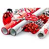 Rolls of Christmas wrapping paper with ribbons, bows and scissors