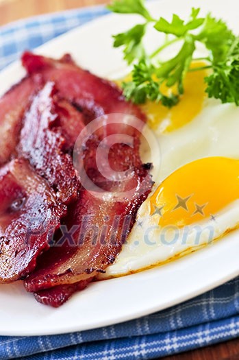 Tasty breakfast of bacon and fried eggs