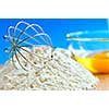 Flour, whisk and eggs in a bowl, baking ingredients