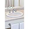 Bathroom interior with white sink, faucet and mirror