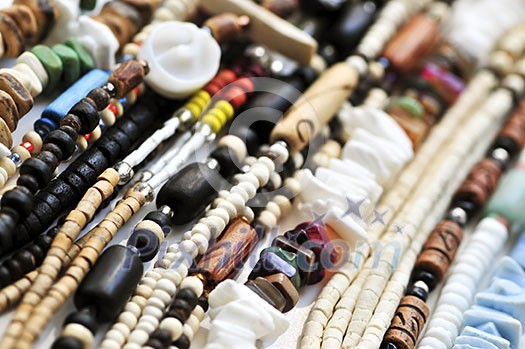 Wood and seashell bead necklaces close up Wood and seashell bead necklaces close up