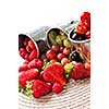 Assorted summer fruits and berries in metal pails