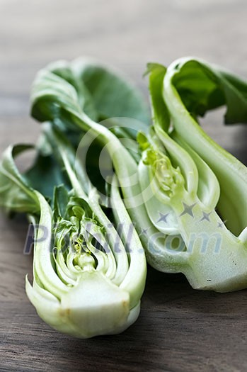 Close up of halved green bok choy vegetable greens Close up of halved green bok choy vegetable greens