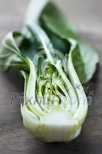 Close up of halved green bok choy vegetable greens Close up of halved green bok choy vegetable greens