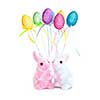 Cute Easter bunny toys and balloons isolated on white background