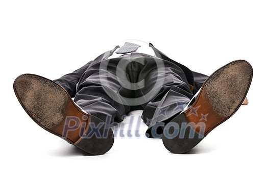 Businessman laying down in a suit isolated on white background Businessman laying down in a suit isolated on white background