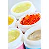 Colorful jars of skin care creams and lotions