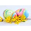 Easter eggs arrangement with yellow forsythia flowers
