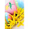 Easter eggs arrangement with yellow forsythia flowers